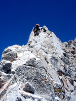 exposed. Some bolts. Kevin going over a tower.Much steeper than it looks since camera pointed up.