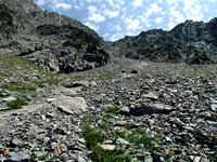 Trail leads to scree slope to col