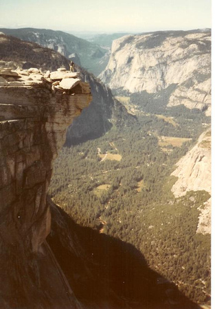 me on the point - people used to base jump off this and El Cap(in background) but now illegal in the park. Over 5000ft to meadows in valley.