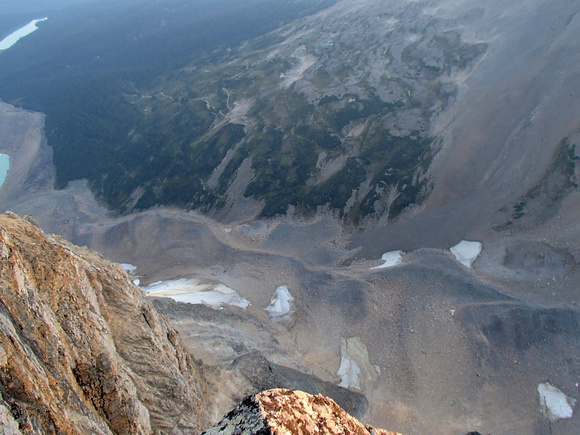 Trail comes off first switch and in gully beside moraine and past two snow patches.