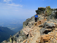 LH side of summit ridge. Summit 20 m past big blocks.